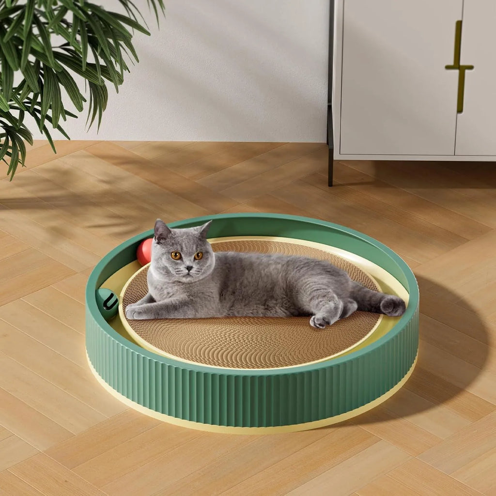 Large green circular cat scratching board with ball track and plush toy for indoor cats
