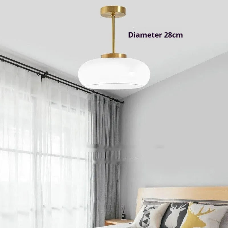 Bauhaus retro style glass pendant ceiling light with three egg tart shaped shades in milk white finish.