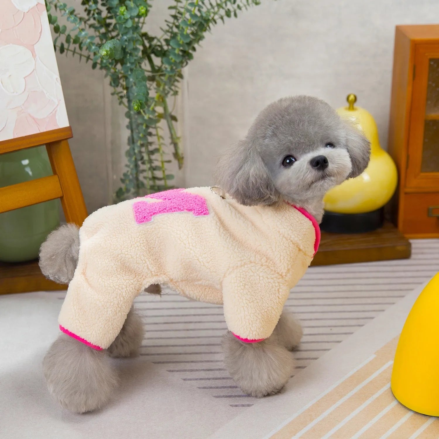 Four legs fluffy jacket pet clothing in beige colour on a small dog, polyester fabric, casual style.