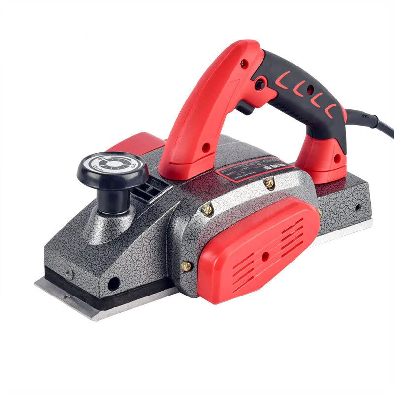 Red desktop electric wood planer with aluminium body showing 82mm planing width