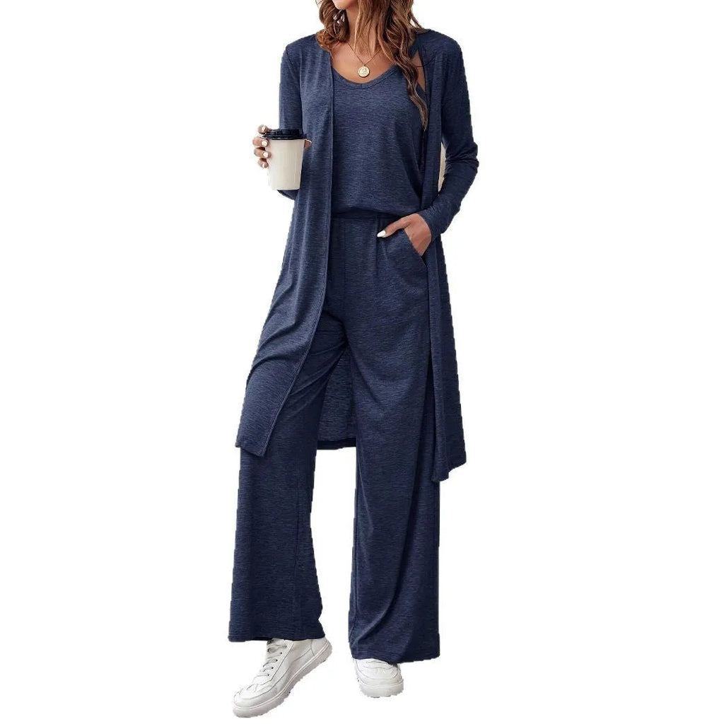 Blue women's three-piece co-ord suit with jumper top, long cardigan, and trousers with suspenders.