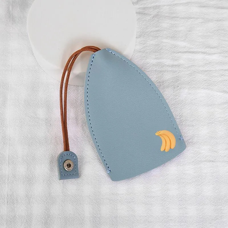 Cartoon pull-out key case in PU leather measuring 14 by 7.5 centimetres