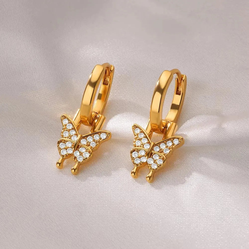 Women's copper butterfly earrings with irregular geometric heart and star designs in multiple colours