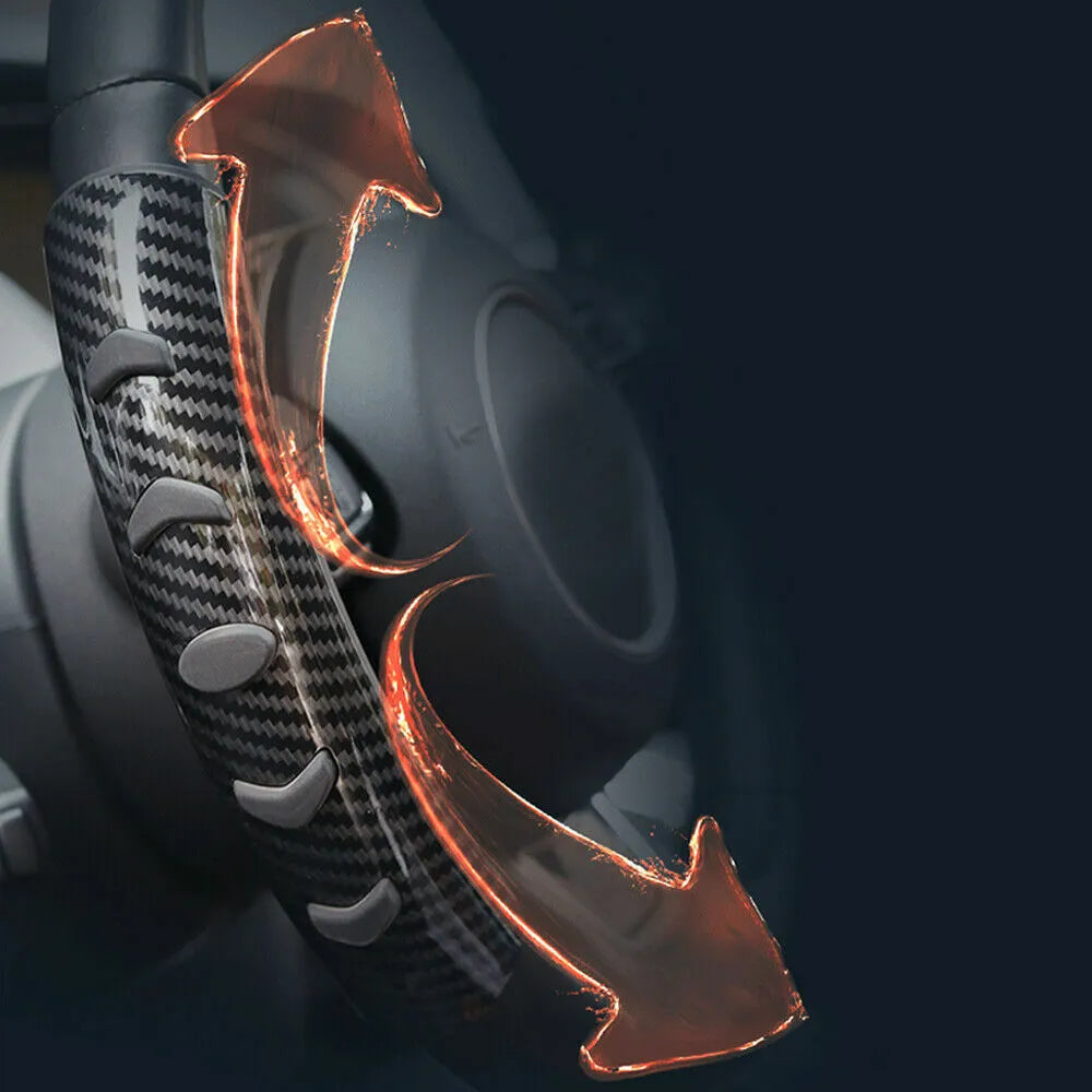 Carbon fibre black fibre anti-skid sleeve on a car steering wheel.