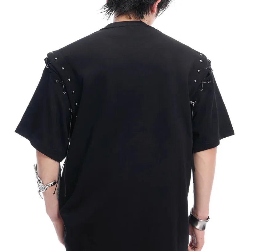 Women's black deconstruction short sleeve t-shirt with a white lace-up detail and front cutout.
