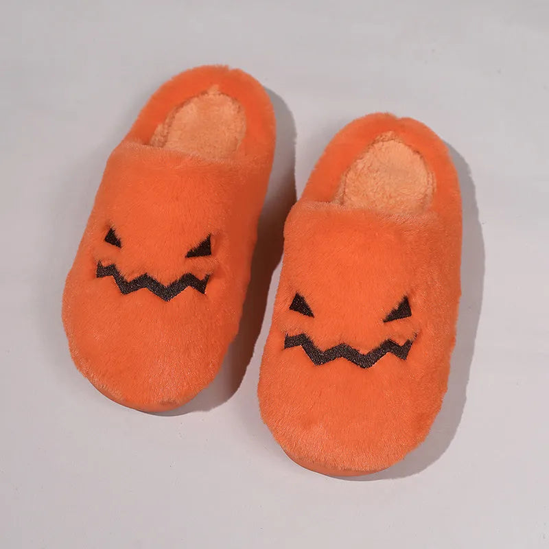 Orange coral velvet Halloween pumpkin-shaped slippers with a flat non-slip PVC sole and plush lining.