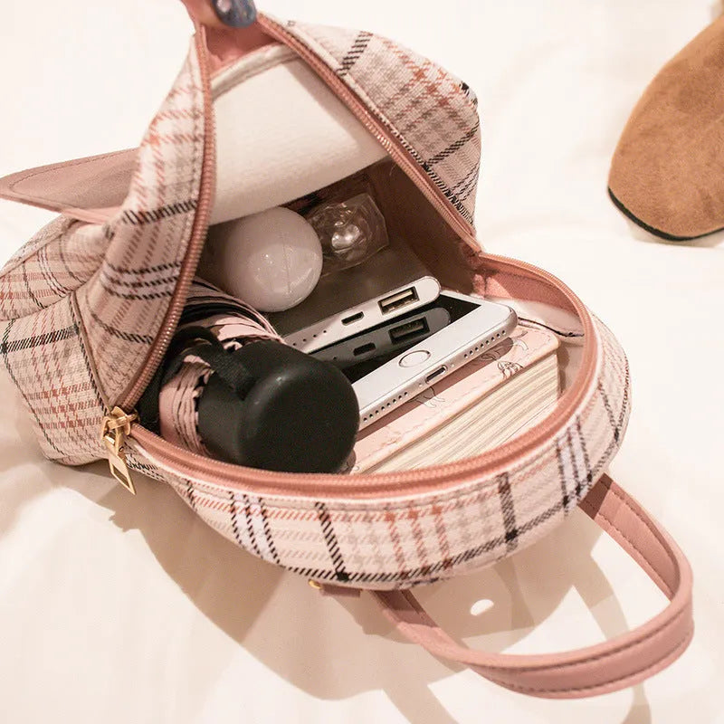 Diagonal cut one shoulder phone bag in PU fabric available in five colours.