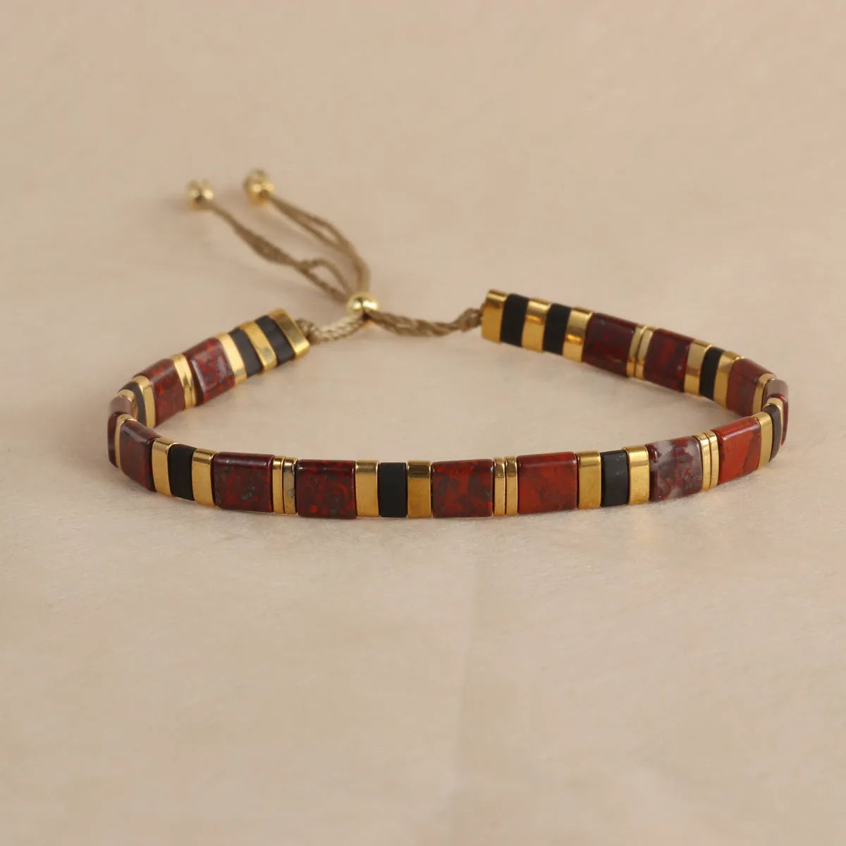 Geometric glass bead bracelet with pull bead closure in five colour options