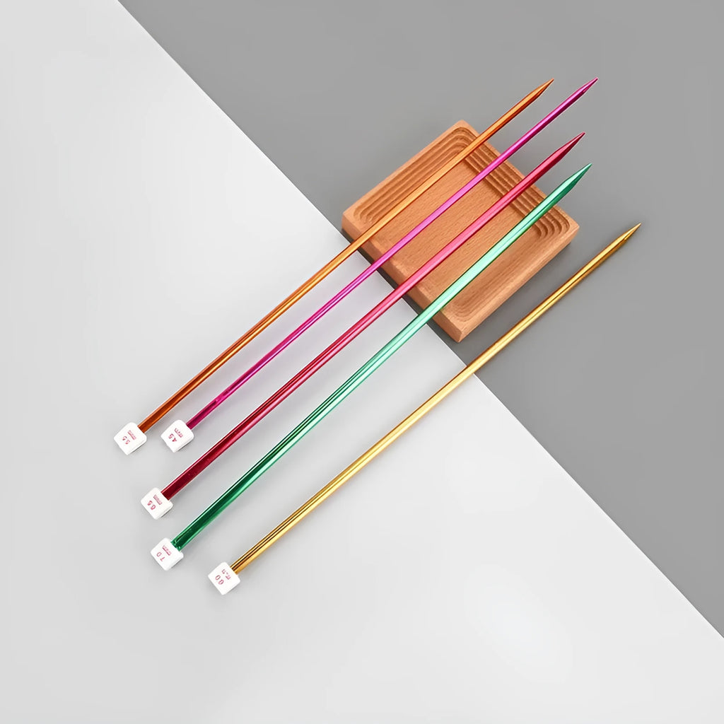 Set of lengthened crochet hooks with protective caps, showing multiple sizes from 2.0mm to 10.0mm for knitting and crochet.
