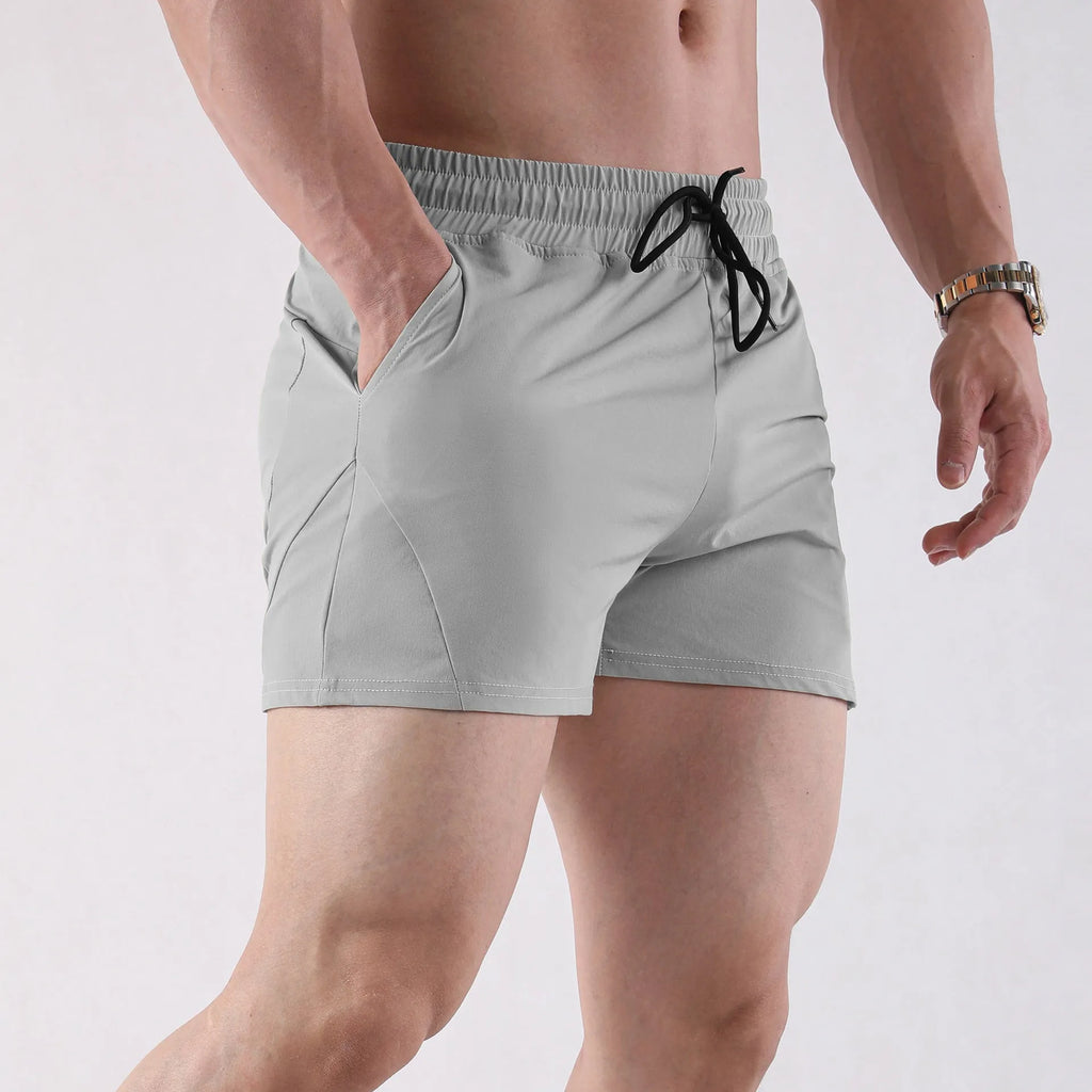 Men's thin grey polyester basketball shorts with elastic waistband, shown flat.