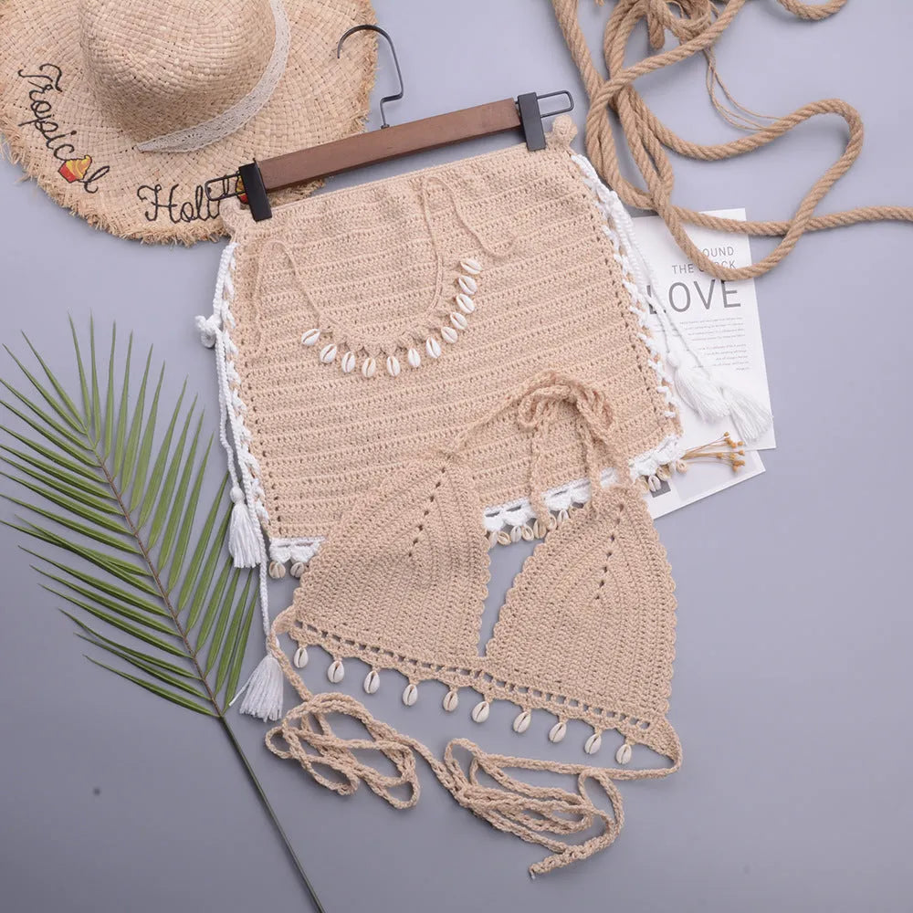 Women's apricot cotton blend split swimsuit with lace-up front on a beach.