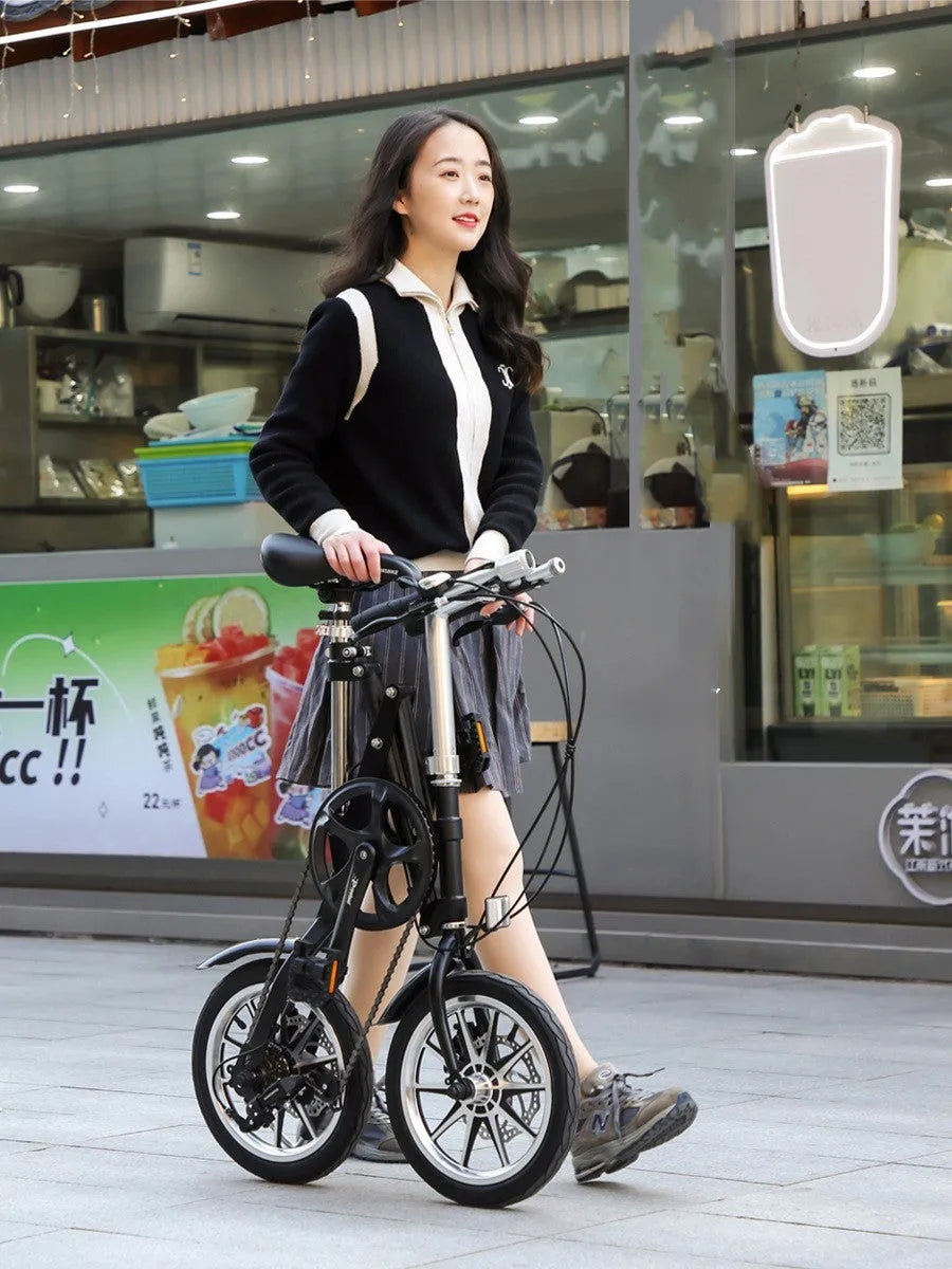 Matte black 14-inch one-second folding bicycle with dual disc brakes and carbon steel frame