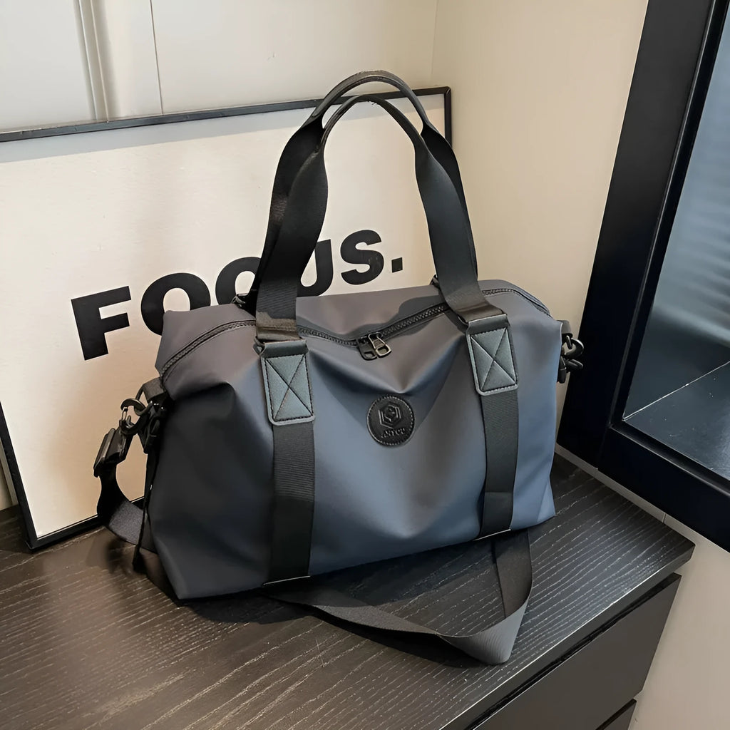 Large black waterproof Oxford cloth travel bag with dry-wet separation compartments.