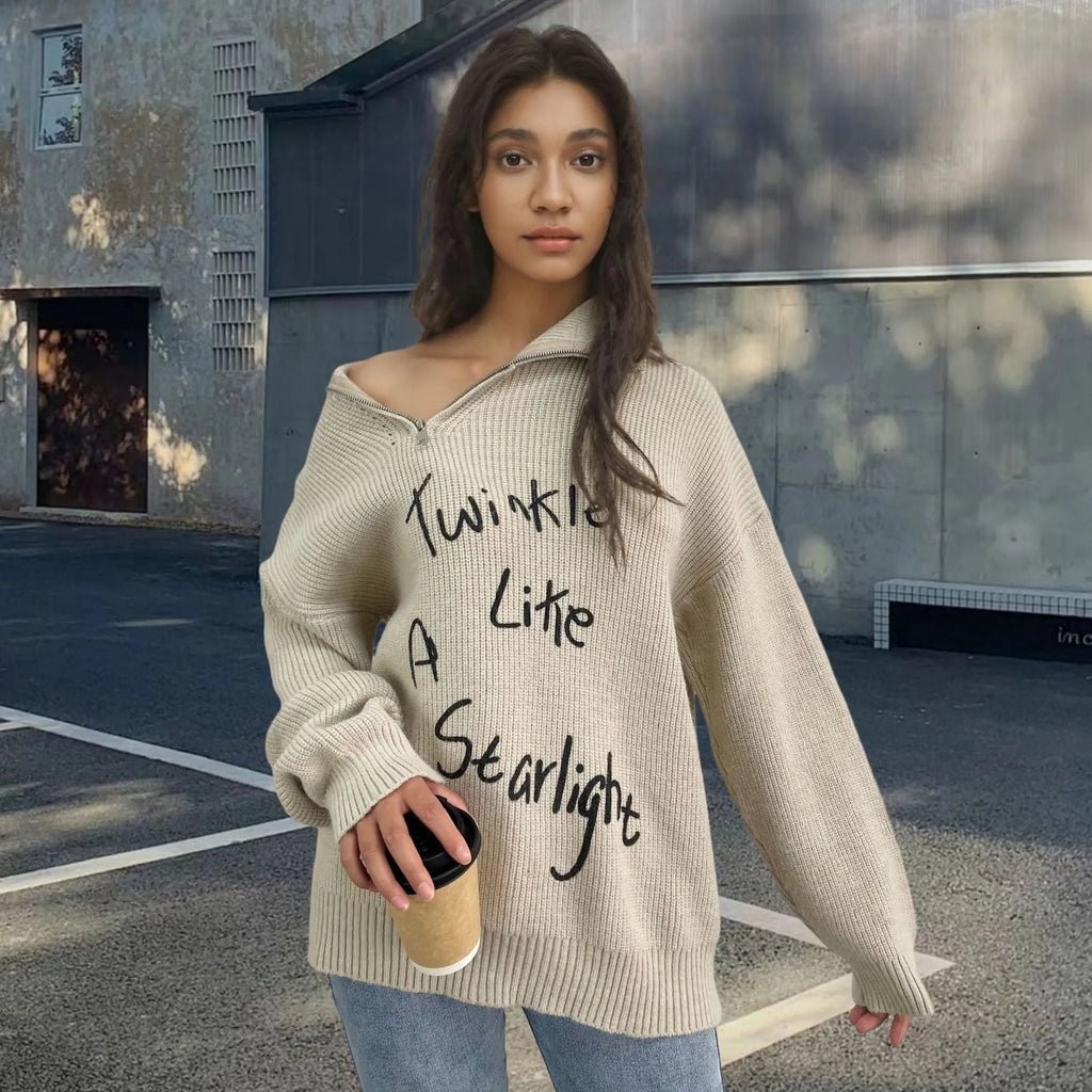 Women's light khaki alpaca fleece sweater with a turtleneck collar and diagonal front zip.