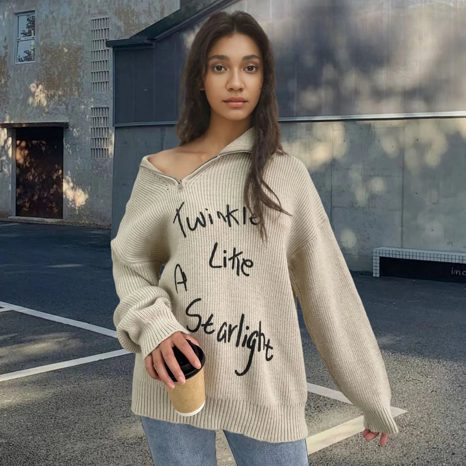 Women's light khaki alpaca fleece sweater with a turtleneck collar and diagonal front zip.