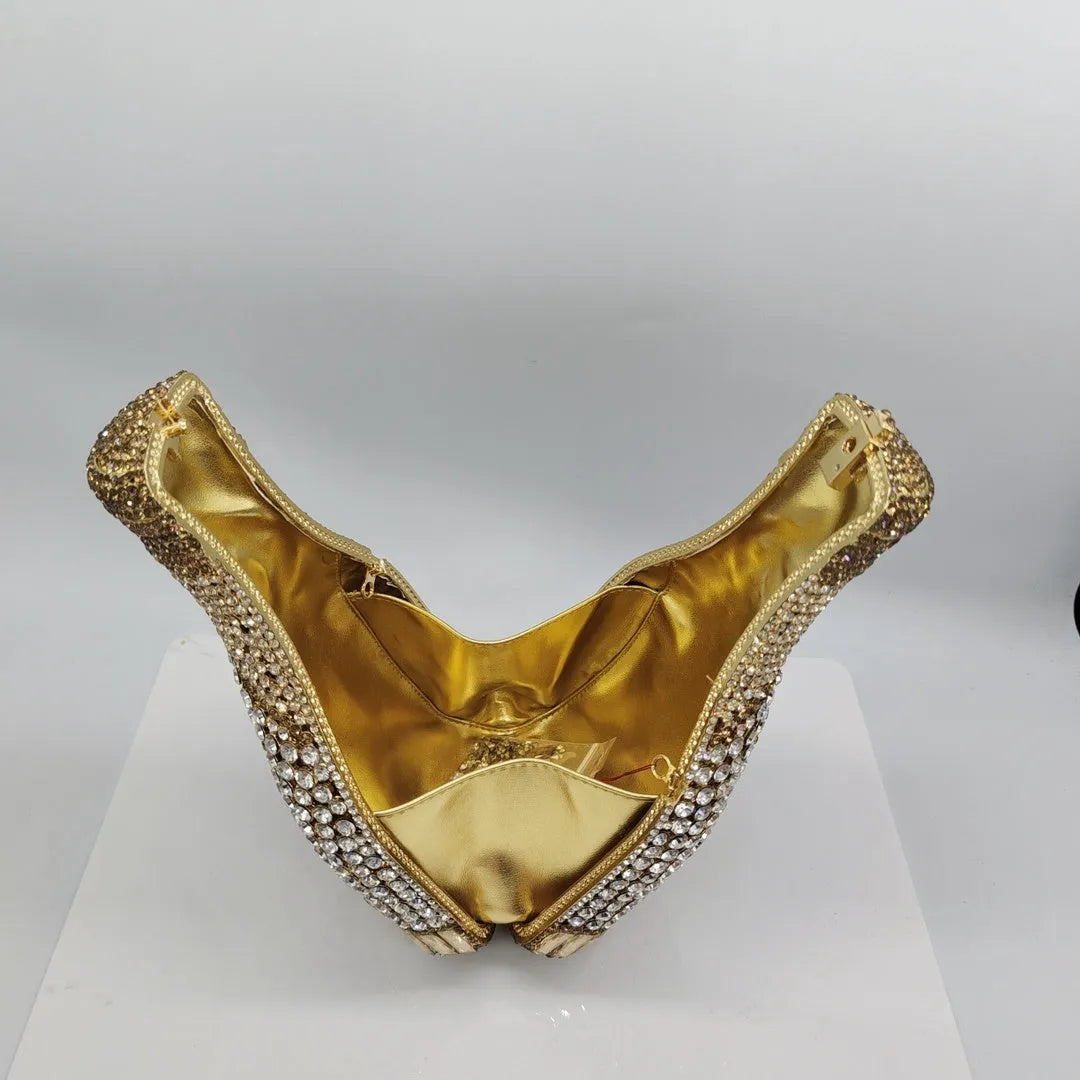 Gold rhinestone evening clutch bag shaped like a champagne bottle with a hard frame.