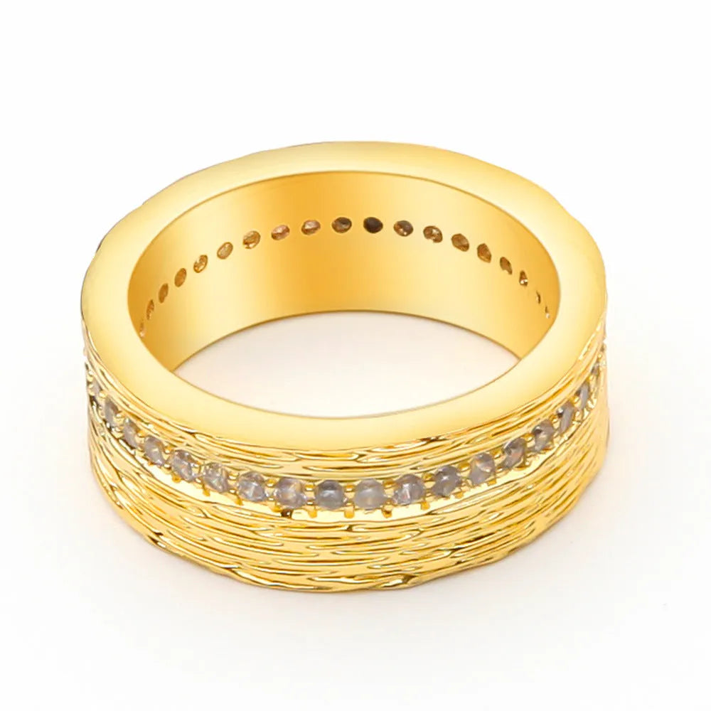 Gold geometric zircon ring for women on a copper base, showing angular design.