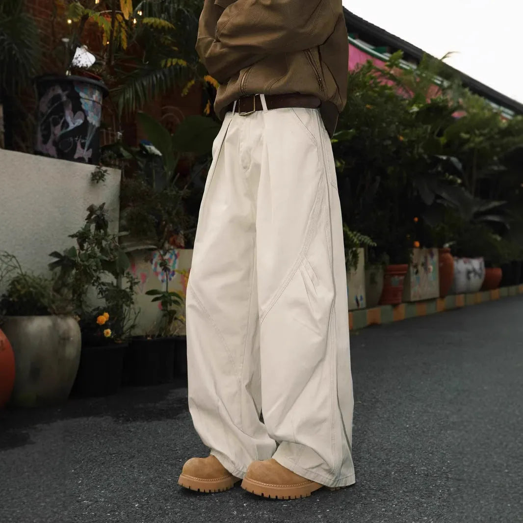 Men's loose-fit pleated trousers in a striped pattern, shown in apricot colour with a straight leg.