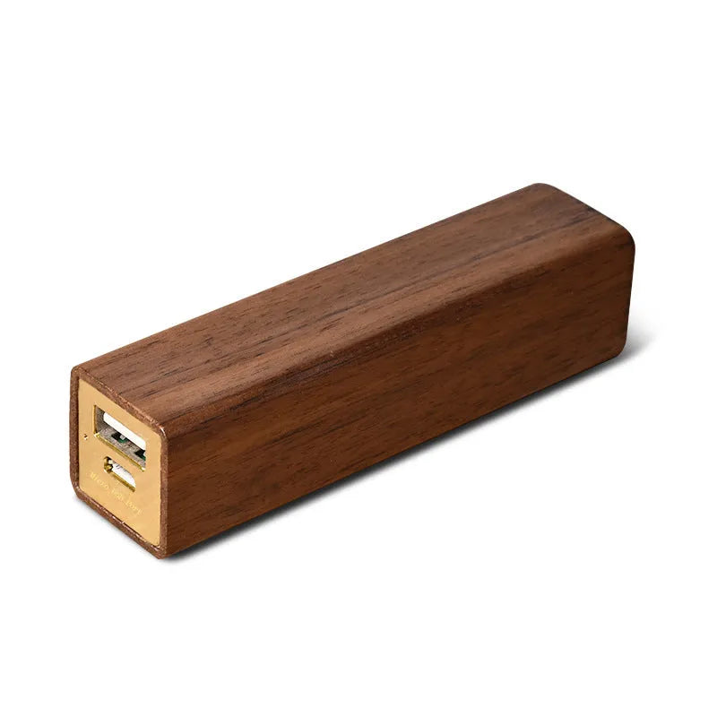 Brown black walnut solid wood portable power bank with 2000mAh capacity.