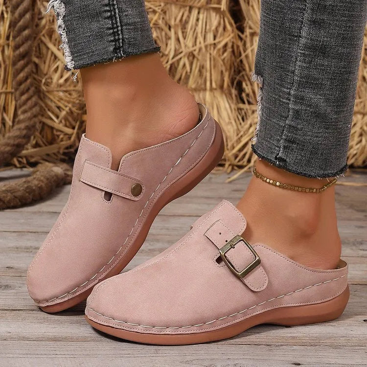 Women's casual wedge slipper in a light brown colour, showing cloth upper and rubber sole.