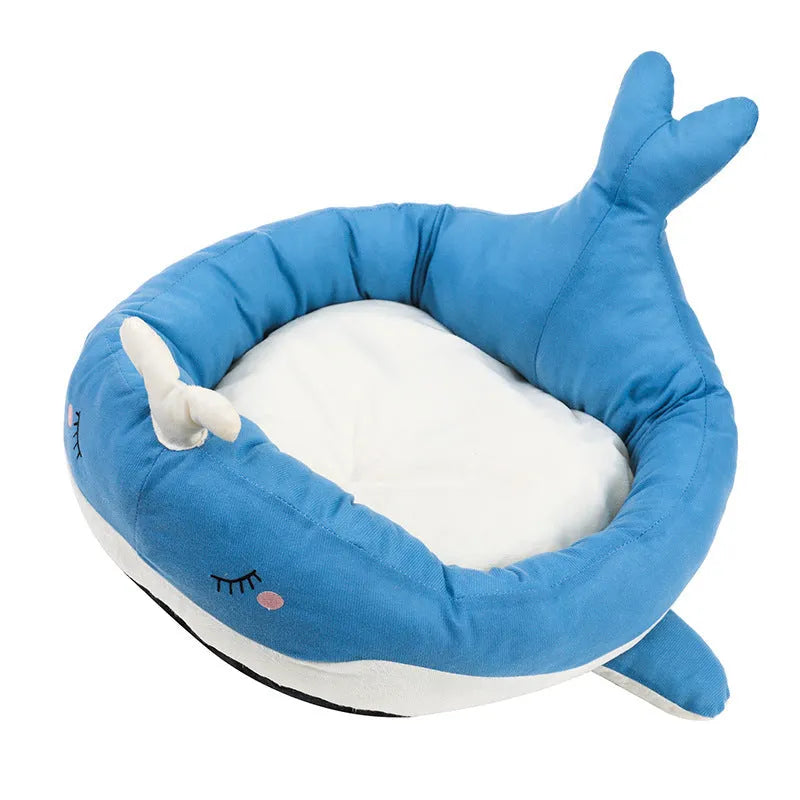 Blue duck-shaped fluffy pet bed sofa for small dogs and cats on a floor.
