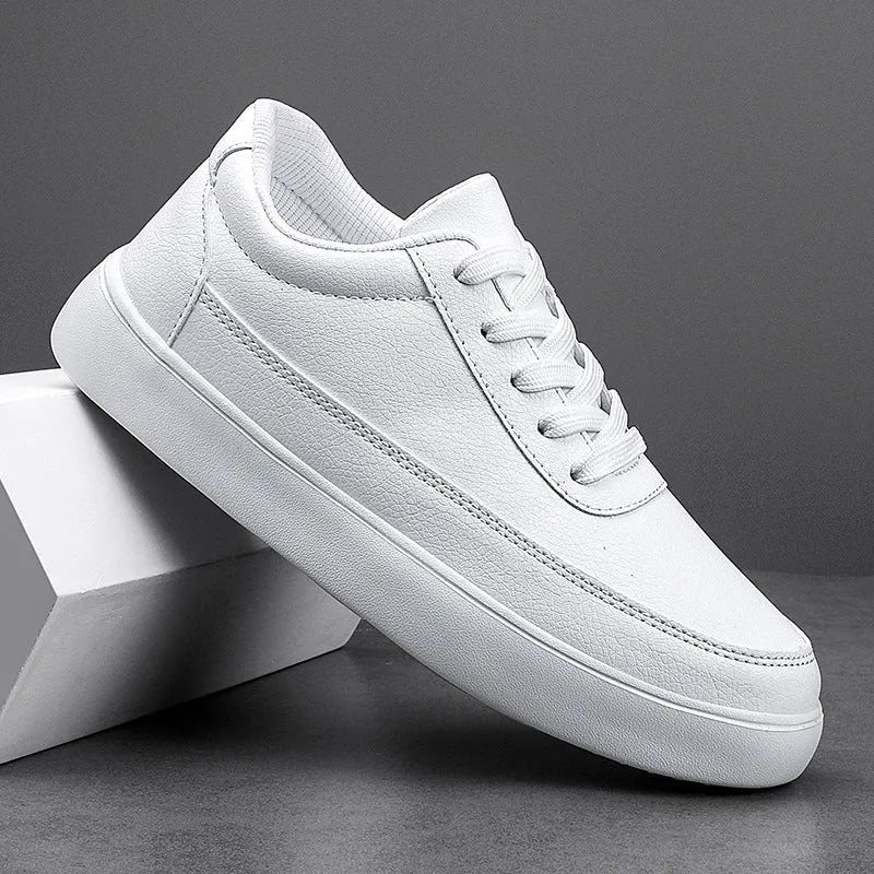 Women's gold leather lace-up flat casual shoes on a white background