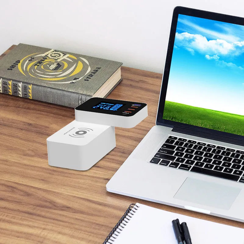 White multi-port wireless charger with USB ports measuring 64.5x98.6x56.5mm