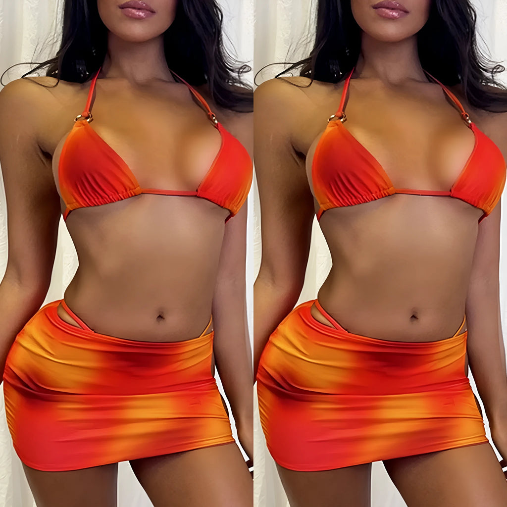 Tie-dye gradient halter bikini three-piece swimwear set with skirt cover-up on mannequin