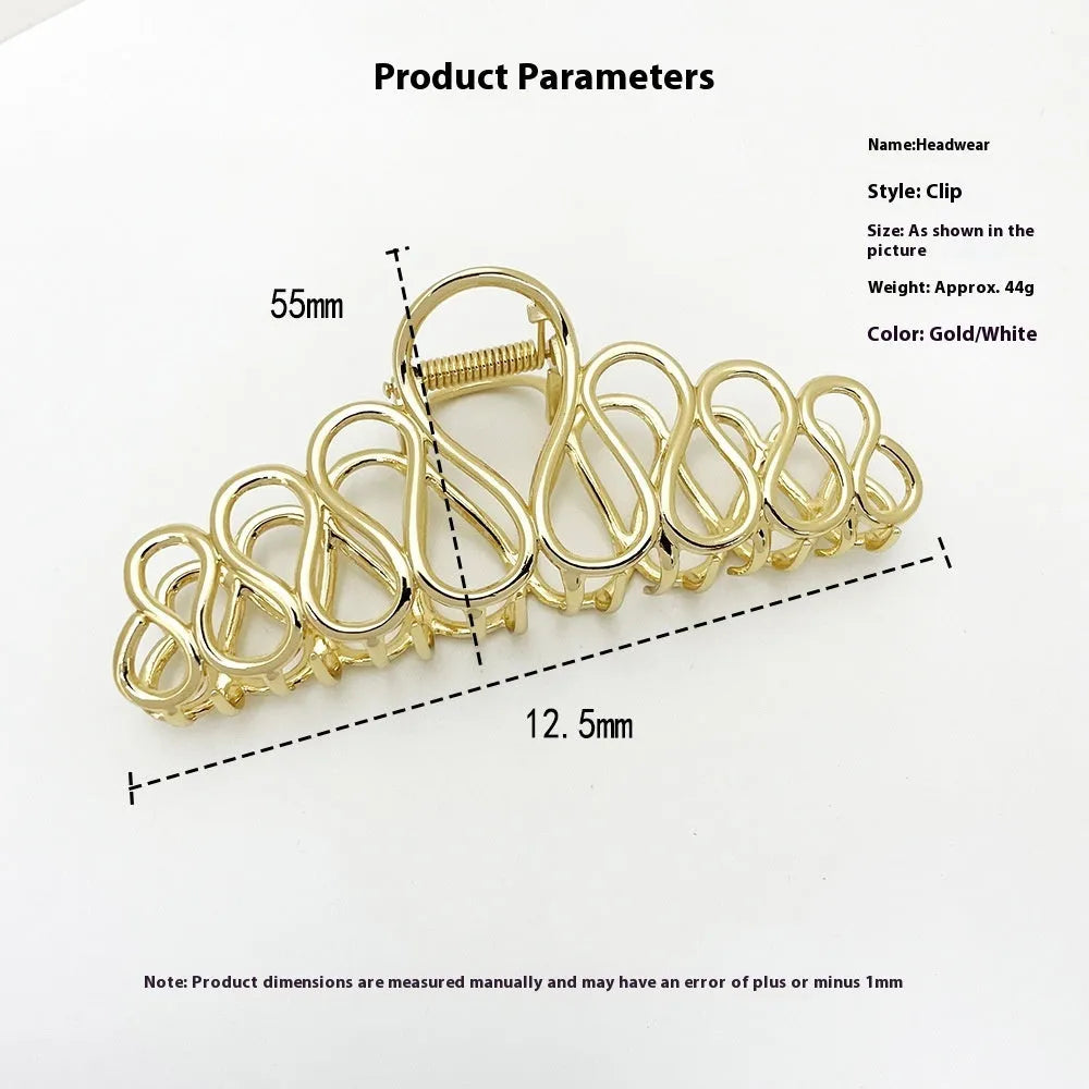 Minimalist large hair clip with tassel detailing in gold or silver metallic finish for updo hairstyles