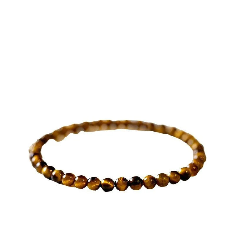 Geometric new Chinese style bracelet with round tigereye stone beads in gold and brown bands.