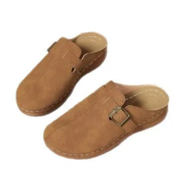 Women's casual wedge slipper in a light brown colour, showing cloth upper and rubber sole.