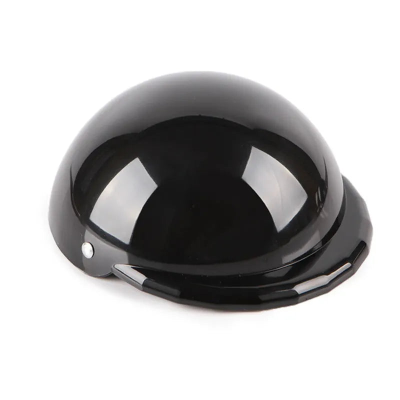 Plastic dog motorcycle cap helmet in various colours and sizes on a table