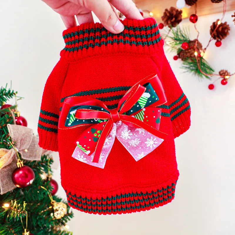 Red Christmas jumper for a small dog on a festive background