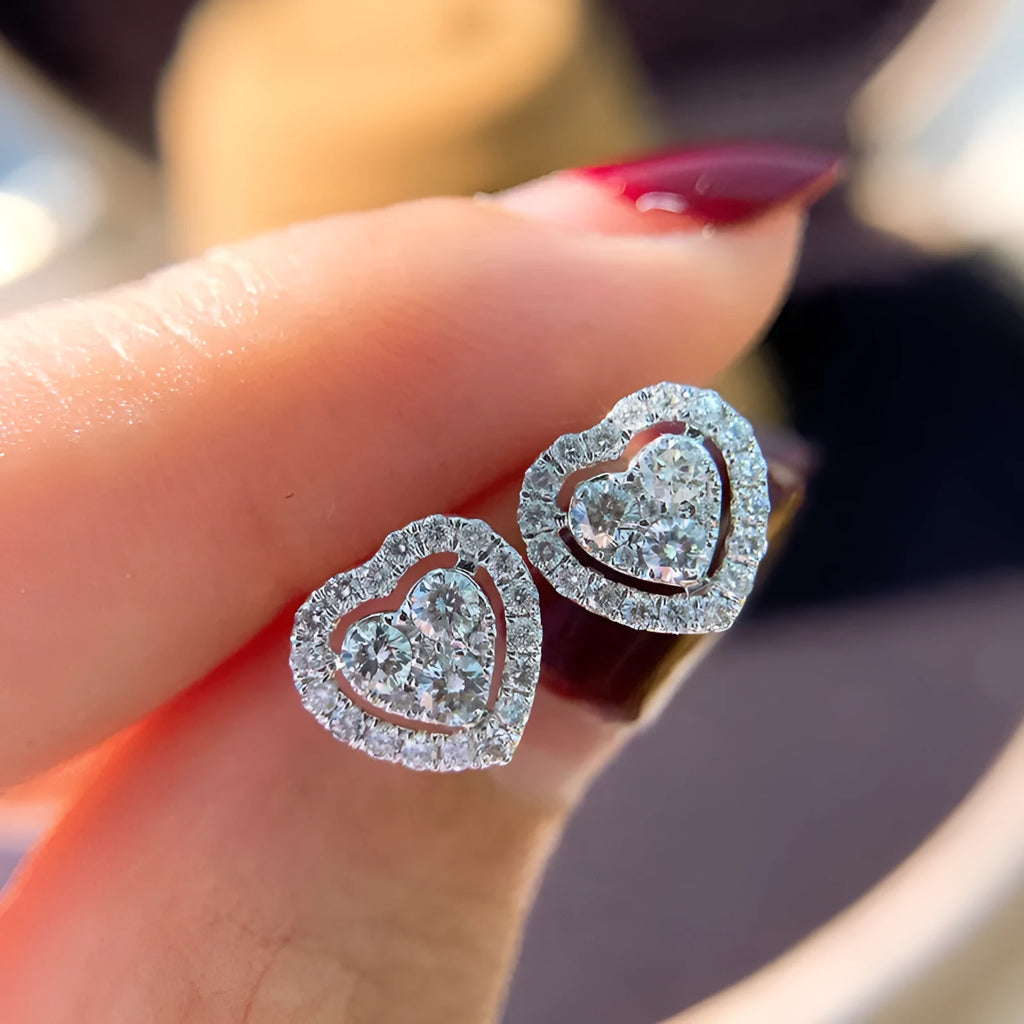 White zircon heart stud earrings with electroplated finish, post-back closure, compact design