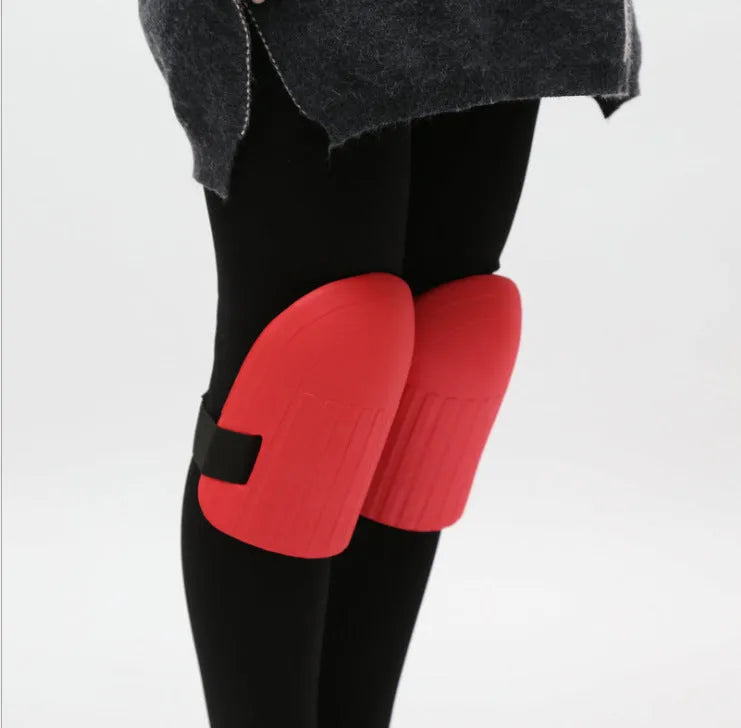 A pair of simple black EVA foam knee pads for gardening, showing their rectangular shape and thickness.
