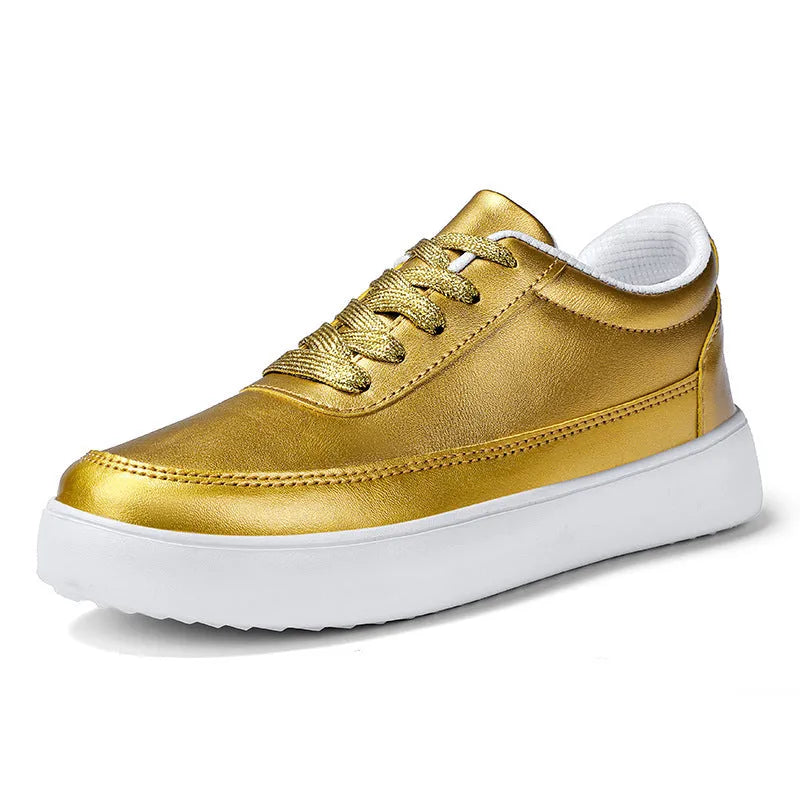 Women's gold leather lace-up flat casual shoes on a white background