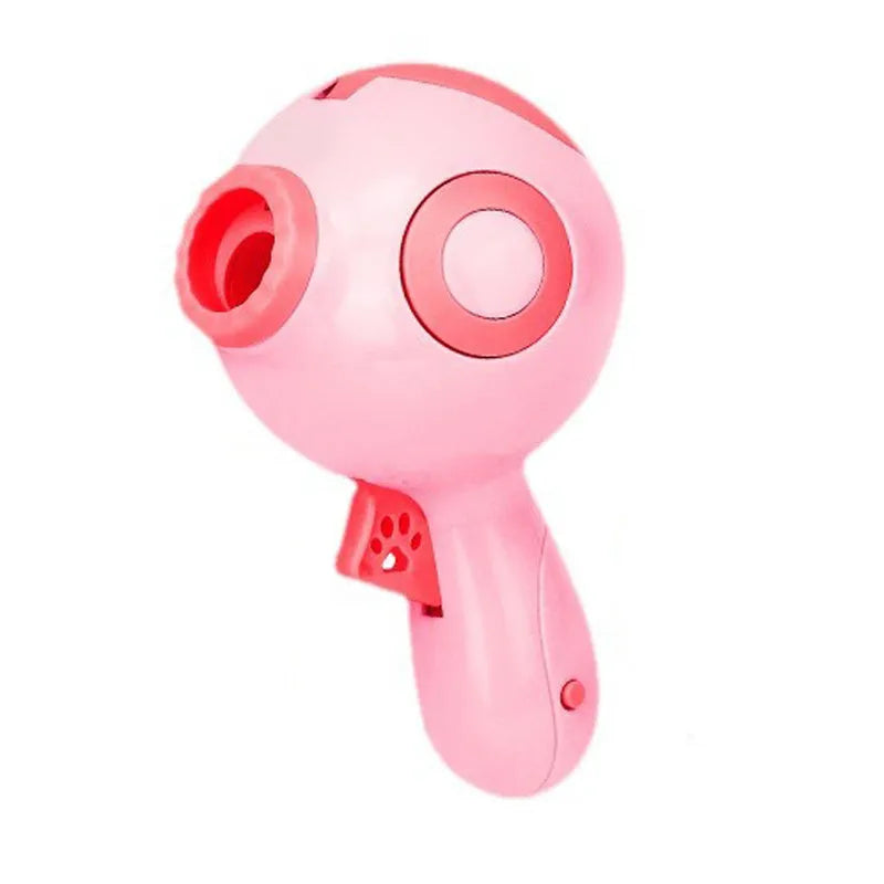 Green, orange, and pink dog treat launcher toy for remote feeding