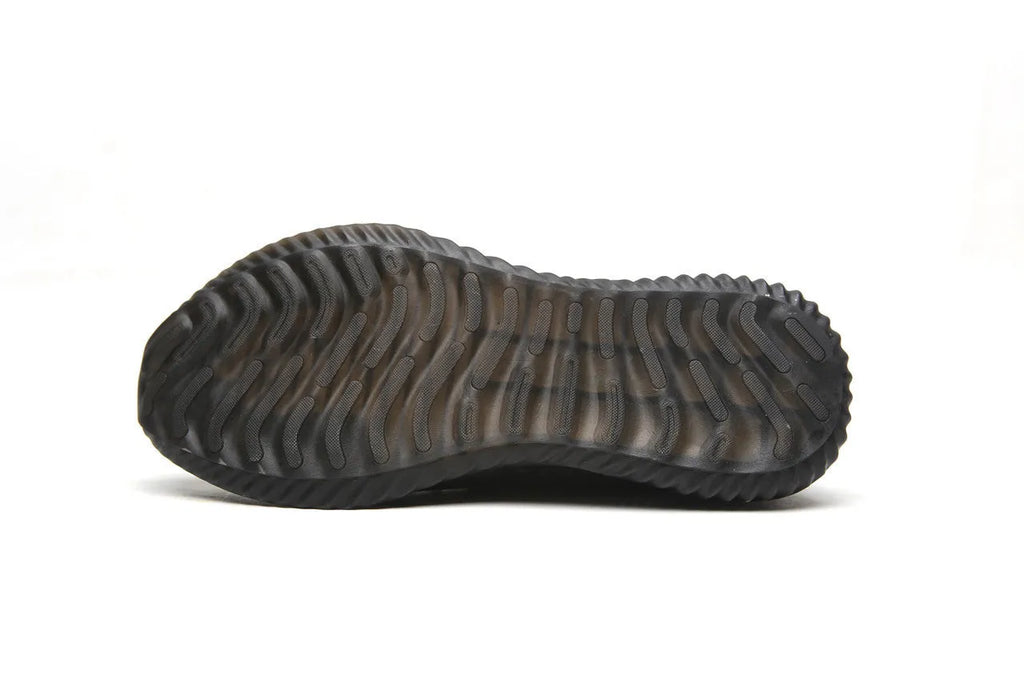 A pair of low-cut safety shoes with a steel toe cap, shown in a dark green colour option.