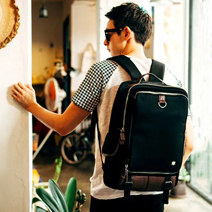 Men's modern Oxford cloth backpack in seven colour options showing dimensions of 30cm wide by 16cm thick by 46cm high