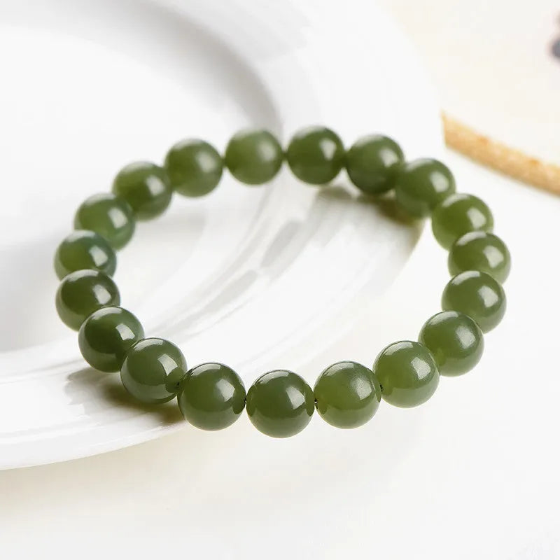 Hetian jade ball bracelet with spherical polished beads in clear colour tones