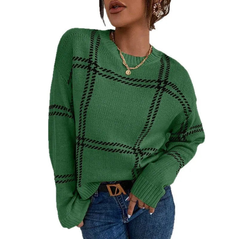 Women's loose-fit plaid sweater with apricot, black, beige, red, and green colour-block stripes.