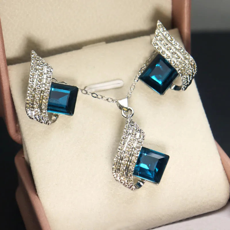 Women's necklace and ear stud set with alloy pendant, cross chain, and glass detailing in electroplated finish