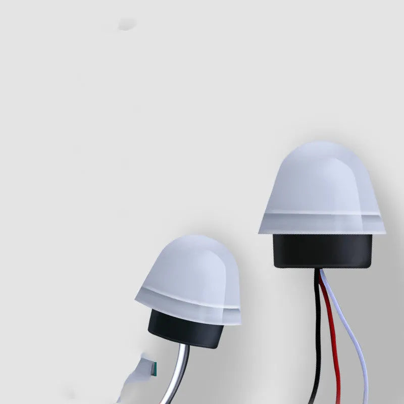 White automatic induction street lamp with sensor for outdoor security lighting.