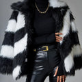 Women's lapel contrast colour faux fur coat with a detachable fur collar on a hanger