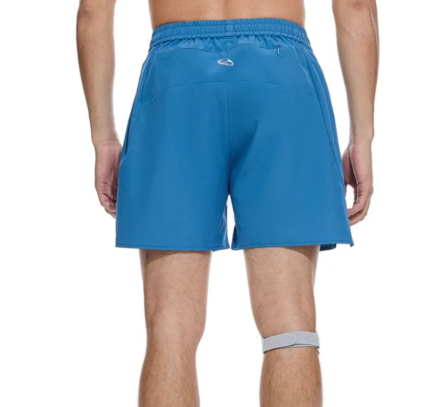 Close-up of black four-point stretch running shorts showing laser stitching detail on spandex fabric.