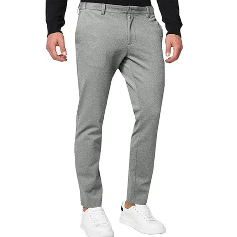Men's slim-fit tapered chino trousers in Army Green colour, showing zipper fly and casual styling.