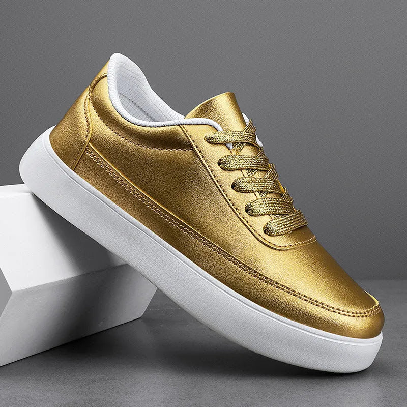 Women's gold leather lace-up flat casual shoes on a white background
