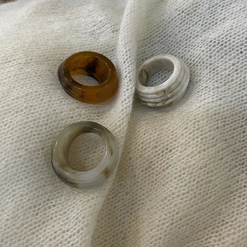 Resin ring with irregular wide band geometric design in Chinese retro style