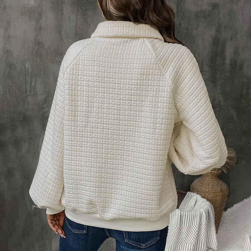 Women's milky white polo collar sweater with long sleeves and textured fabric.
