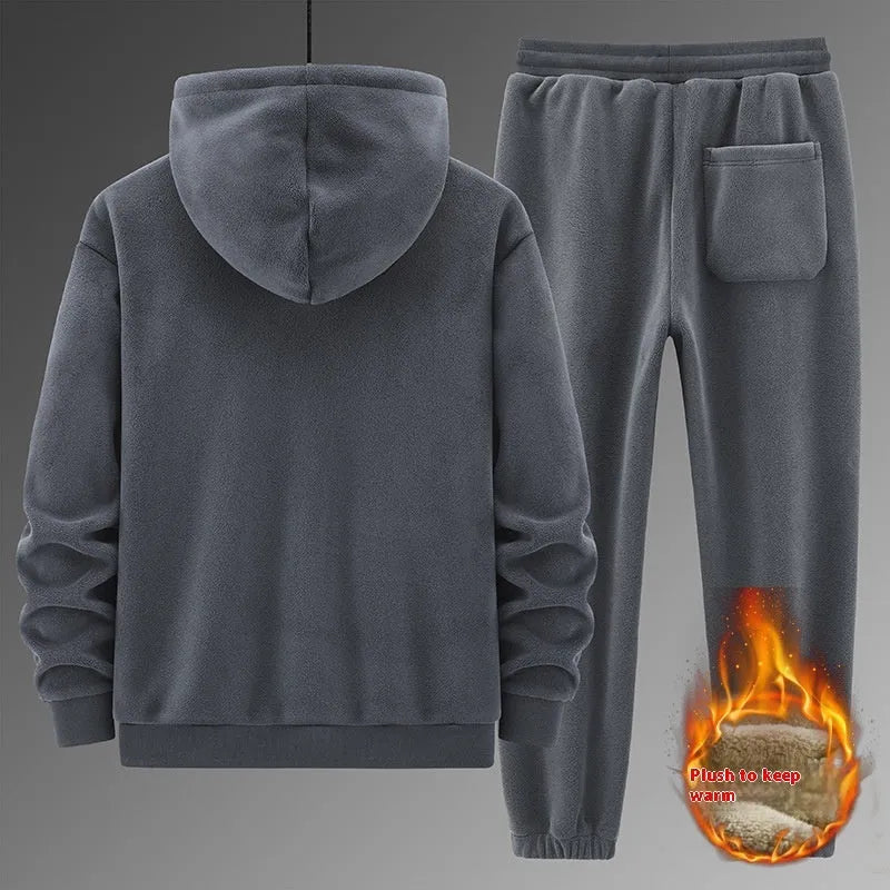 Men's grey hooded sports sweater and matching trousers laid flat.